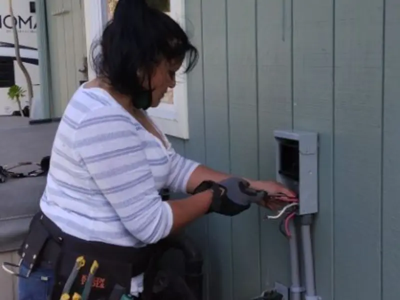Licensed electrician wiring an exterior subpanel in Pike Road