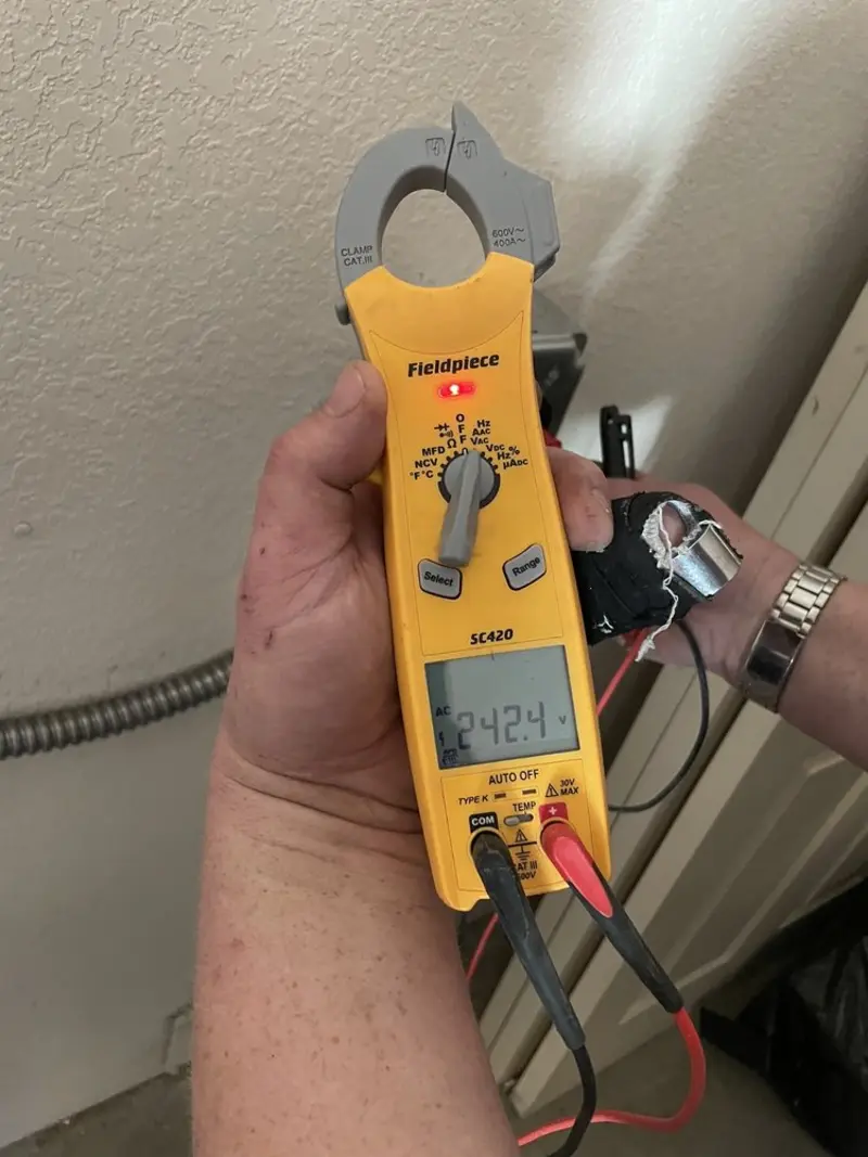 Voltage testing with clamp meter during Recessed Lighting Installation in Pike Road